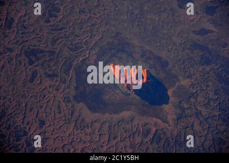 AUSTRALIA - 27 January 2017 - ESA astronaut Thomas Pesquet took this amazing sunset view of Uluru (or Ayer's Rock as it is more commonly kown) from th Stock Photo