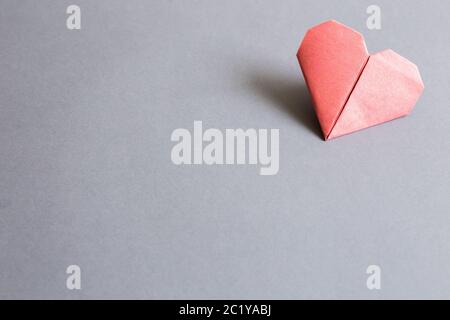 Red paper heart origami on gray background. copy space Stock Photo