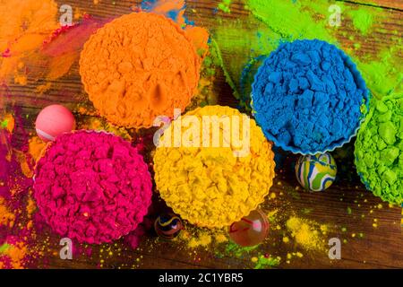 Assorted bright podwer color samples on dark background Stock Photo