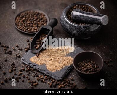 Whole and milled black pepper Stock Photo