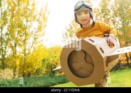 Happy little boy play to fly Stock Photo