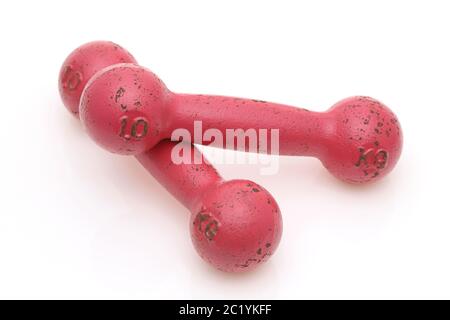 Two pink painted dumbbells fitness isolated on white background Stock Photo