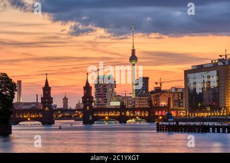 Beautiful sunset at the Oberbaum Bridge and the famous Television Tower in Berlin Stock Photo
