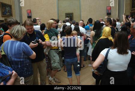 Louvre Museum, visitors in front of the Mona Lisa Stock Photo