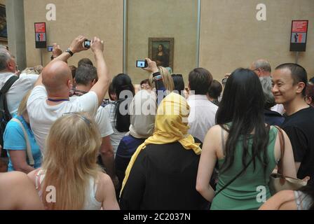 Louvre Museum, visitors in front of the Mona Lisa Stock Photo