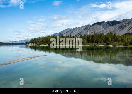 Reflections at Lake Muncho in Canada Stock Photo