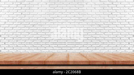 Empty wooden table top, counter or shelf on white brick wall background, For food display banner, backdrop. Stock Photo