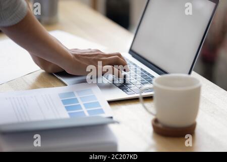 Close up of businesswoman typing on laptop gadget Stock Photo