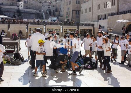 Jerusalem Israel May 14, 2018 Unknowns kids dancing front the Western wall in the old city of Jerusalem in the evening Stock Photo