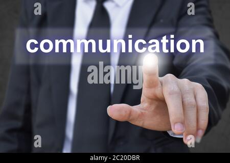Businessman hand pressing communication button. Idea for business, technology and internet. Stock Photo