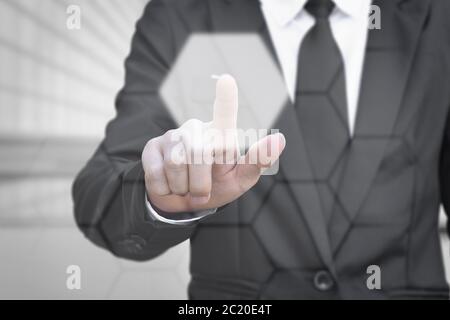 Businessman pressing touch screen interface. Idea for about technology and choices business. Stock Photo