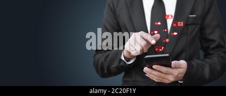 Businessman using smartphone with icon (mobile phone, email, address), Copy space. Concept of customer service call center contact. contacting informa Stock Photo