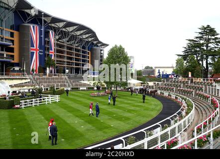 Jockeys waiting to mount their horses in the parade ring prior to the King's Stand Stakes during day one of Royal Ascot at Ascot Racecourse. Stock Photo