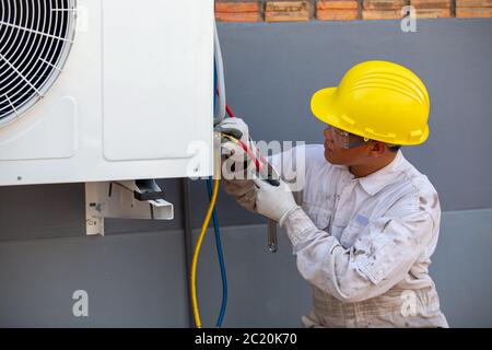 Air-conditioning installation by expert technicians Stock Photo