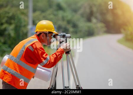 Surveyor marking road construction and land Stock Photo