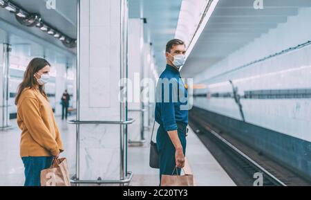 passengers in protective masks waiting for the metro train Stock Photo
