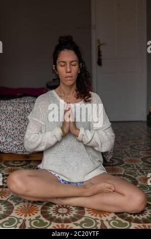 Woman portrait meditating on the floor Stock Photo