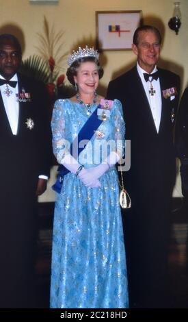 Queen Elizabeth II with The Duke of Edinburgh and Sir Hugh Springer, Governor General of Barbados at a State Occasion in Barbados. 1989 Stock Photo