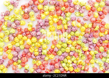 Colored popcorn on white background top view Stock Photo