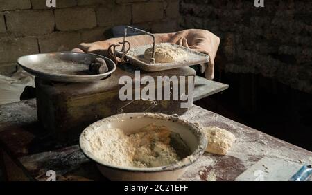 dough preparation for scones weighing on old scales Stock Photo