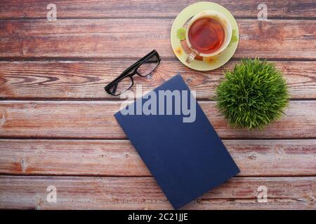 book with empty cover, pen and keyboard on table  Stock Photo
