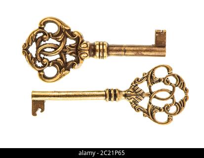 Golden antique keys isolated on white background. vintage accessories Stock Photo