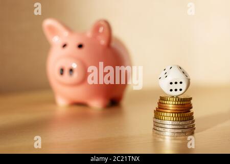 pink piggy Bank is on the table, coins Stock Photo