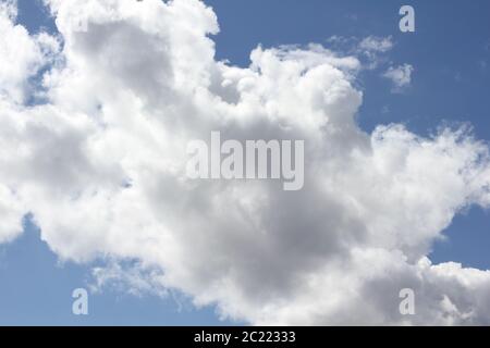 Cumulus clouds in the blue sky above the Baltic Sea Stock Photo