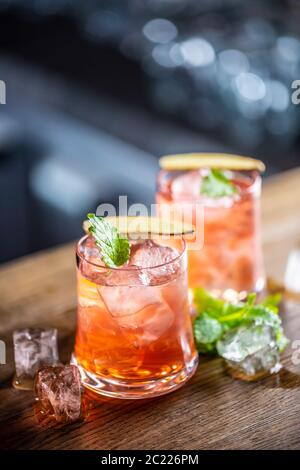 Vodka and cranberry in two glasses on a bar Stock Photo