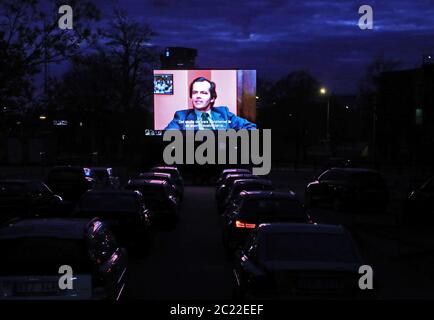 Linkoping, Sweden 20200425 Stanley Kubrick's 'The Shining' is shown at a drive-in cinema in central Linköping during Saturday night in these corona times. Staff on roller skates order candy and popcorn during the movie. Photo Jeppe Gustafsson Stock Photo