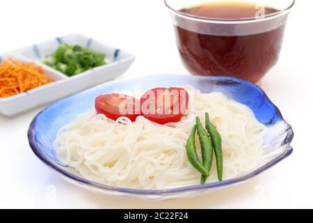 Japanese somen noodles in a glass plate with Mentuyu on white background Stock Photo