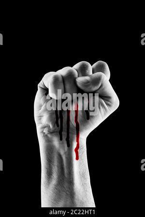 Raised hand showing fist with red blood isolated on black background