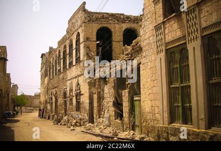 Ruined Colonial style building at the street of Massawa in Eritrea Stock Photo