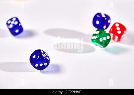 colorful dices in motion on white background Stock Photo