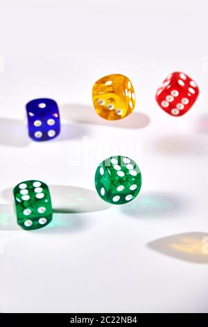 colorful dices in motion on white background Stock Photo