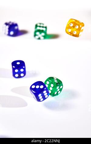 colorful dices in motion on white background Stock Photo