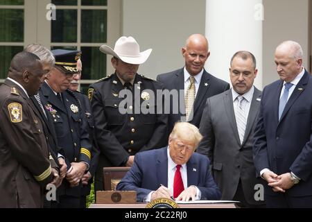 Washington, United States. 16th June, 2020. United States President Donald J. Trump signs an Executive Order on Safe Policing for Safe Communities in the Rose Garden of the White House in Washington DC, on Tuesday, June 16, 2020. Pool photo by Stefani Reynolds/UPI Credit: UPI/Alamy Live News