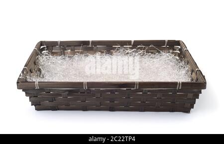 Shredded plastic  filler in wicker packaging tray isolated on white Stock Photo
