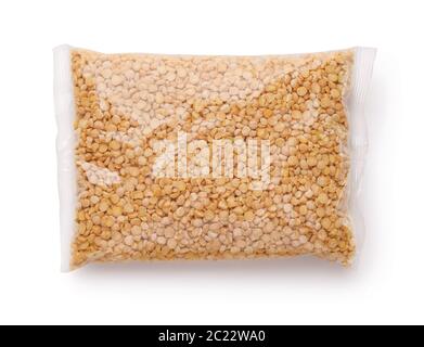 Plastic bag of dry yellow split peas isolated on white Stock Photo