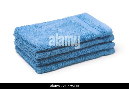 Stack of blue soft terry towels isolated on white Stock Photo