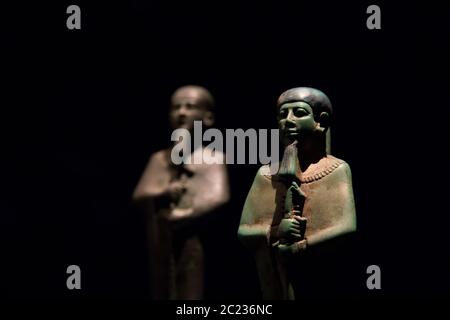 Statues of ancient Egyptian pharaohs and gods. Various hieroglyphs on ...