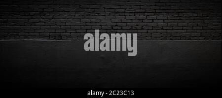 Black brick and stucco background, subtle textured backdrop, creative vignette copy space, horizontal aspect Stock Photo