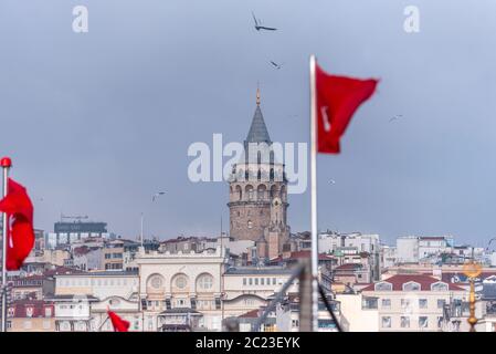 Istanbul, Galata tower and red Turkish flag, Turkey Stock Photo