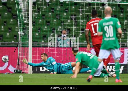 Bremen, Germany. 16th June, 2020. Football: Bundesliga, Werder Bremen - FC Bayern Munich, 32nd matchday at the Wohninvest Weser Stadium. Bavarian goalkeeper Manuel Neuer (l) saves. Credit: Martin Meissner/AP-Pool/dpa - IMPORTANT NOTE: In accordance with the regulations of the DFL Deutsche Fußball Liga and the DFB Deutscher Fußball-Bund, it is prohibited to exploit or have exploited in the stadium and/or from the game taken photographs in the form of sequence images and/or video-like photo series./dpa/Alamy Live News Stock Photo