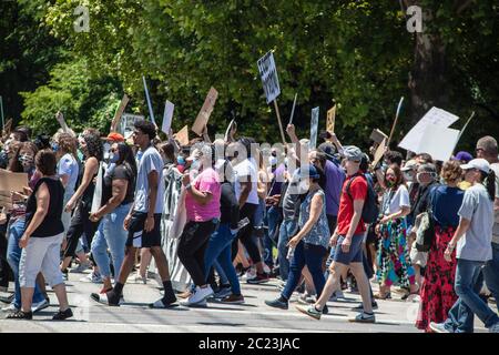 05-30-2020 Tulsa USA People marching together down street with signs in BLM rally- black and white young and old together Stock Photo