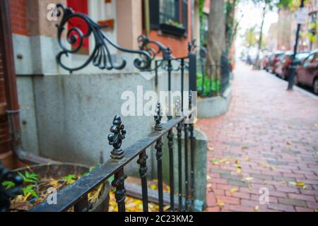 Selective focus on foreground with blurred background in street scene in plush residential suburb in Boston New England Stock Photo