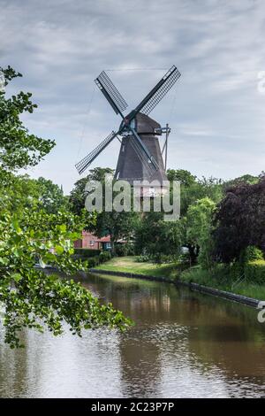 Three-story Windmill in Hinte, Lower Saxon Mill Road, East Frisia, Germany Stock Photo