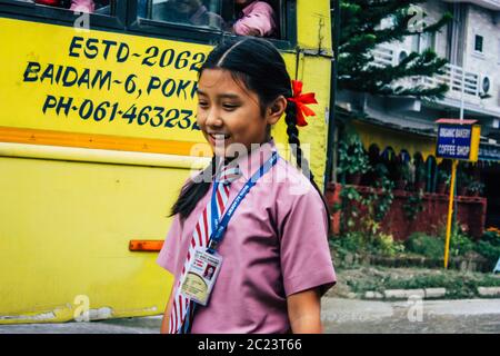 Pokhara Nepal October 4, 2018 Portrait of children coming from the school in a traditional Nepalese school bus at Pokhara in the afternoon Stock Photo