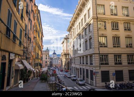 Genoa, Italy - August 20, 2019: Cityscape in the historic center of Genoa and dome of San Lorenzo Cathedral on background, Liguria region Stock Photo