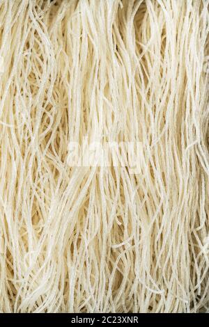 Close-up of uncooked white rice noodles. Stock Photo